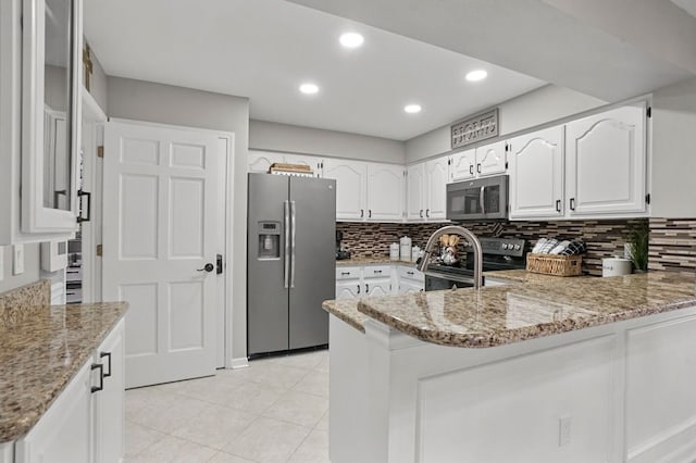 48775 Windmill Cir W, Macomb, MI 48044 - kitchen featuring stainless steel appliances, a peninsula, light stone countertops, backsplash, and white cabinetry