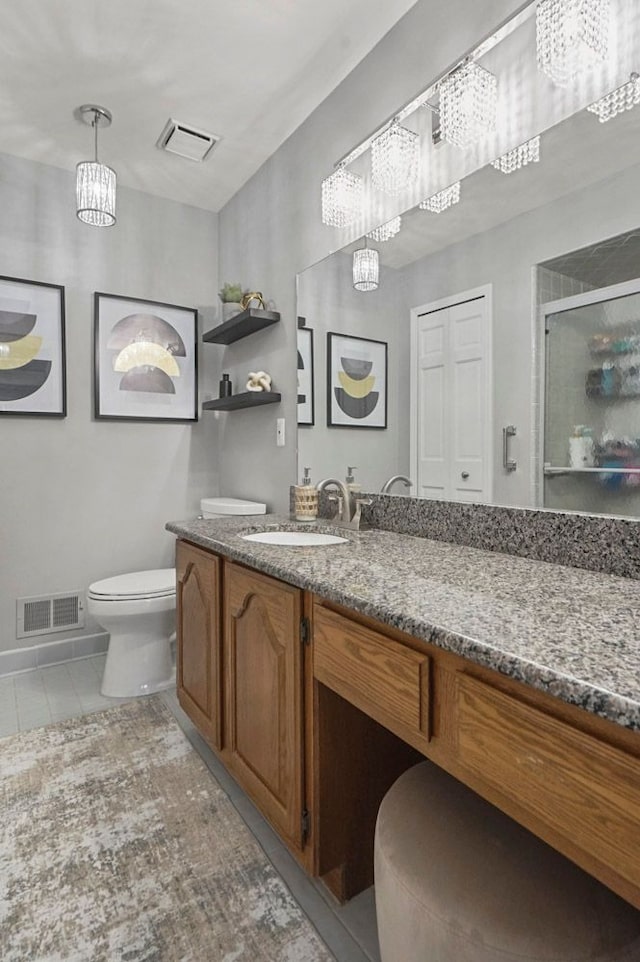 48775 Windmill Cir W, Macomb, MI 48044 - bathroom featuring a chandelier, toilet, a stall shower, and vanity