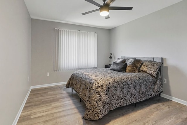 48775 Windmill Cir W, Macomb, MI 48044 - bedroom featuring wood finished floors, baseboards, and ceiling fan