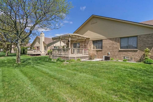 48775 Windmill Cir W, Macomb, MI 48044 - back of property with a pergola, a wooden deck, central AC unit, and a yard