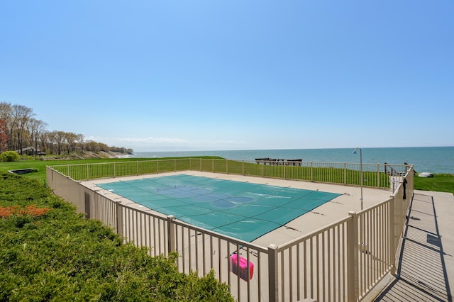 4150 Ridge Rd Unit 21, Stevensville, MI 49127 - view of pool with fence, a water view, and a patio area