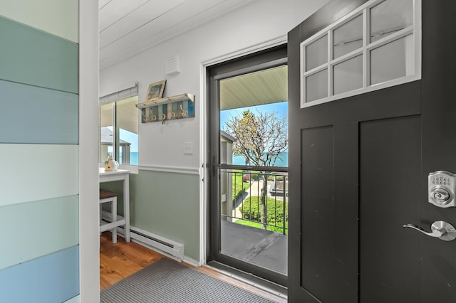 4150 Ridge Rd Unit 21, Stevensville, MI 49127 - doorway with wood finished floors and a baseboard radiator