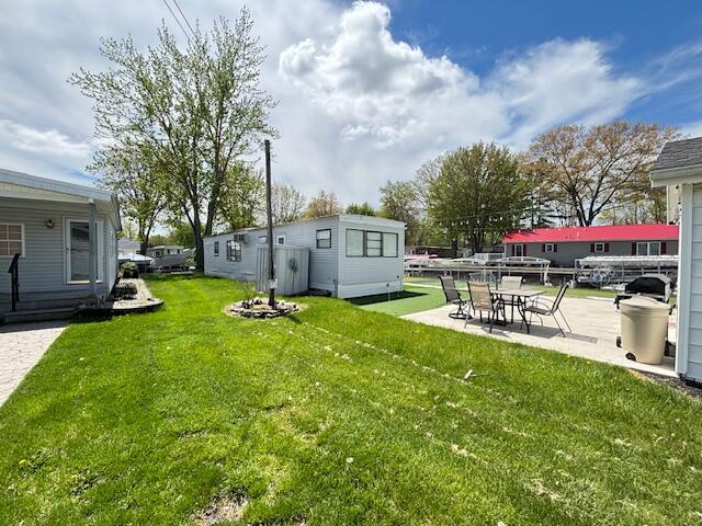 481 Maple Ln, Coldwater, MI 49036 - view of grassy yard featuring a patio