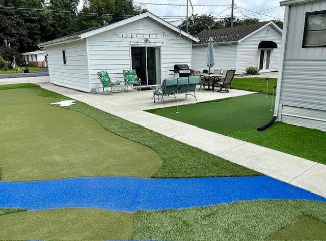 481 Maple Ln, Coldwater, MI 49036 - view of yard featuring an area to practice putting and a patio