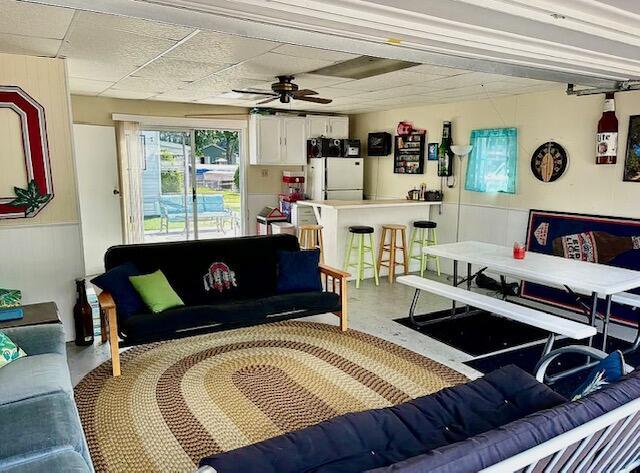 481 Maple Ln, Coldwater, MI 49036 - living room with a ceiling fan and finished concrete flooring