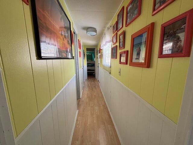 481 Maple Ln, Coldwater, MI 49036 - corridor with a decorative wall and light wood-style flooring