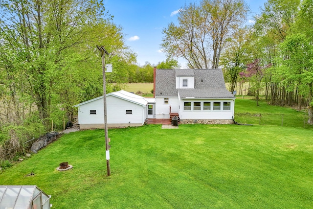 465 Ridge Rd, Quincy, MI 49082 - back of property with a fire pit and a shingled roof