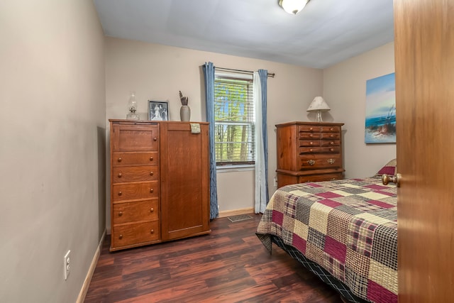 465 Ridge Rd, Quincy, MI 49082 - bedroom featuring dark wood-style floors and baseboards