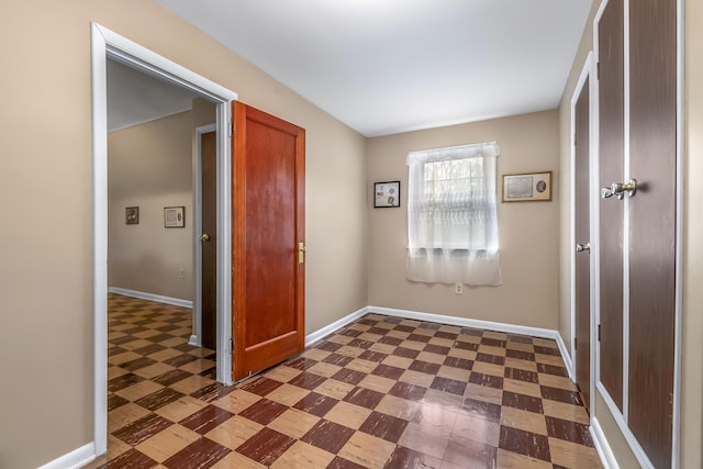 465 Ridge Rd, Quincy, MI 49082 - doorway featuring dark floors and baseboards
