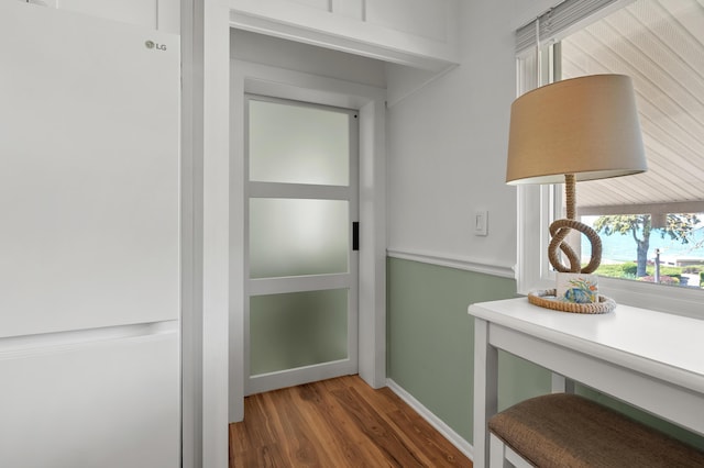 4150 Ridge Rd Unit 21And 22, Stevensville, MI 49127 - doorway featuring wood finished floors and baseboards
