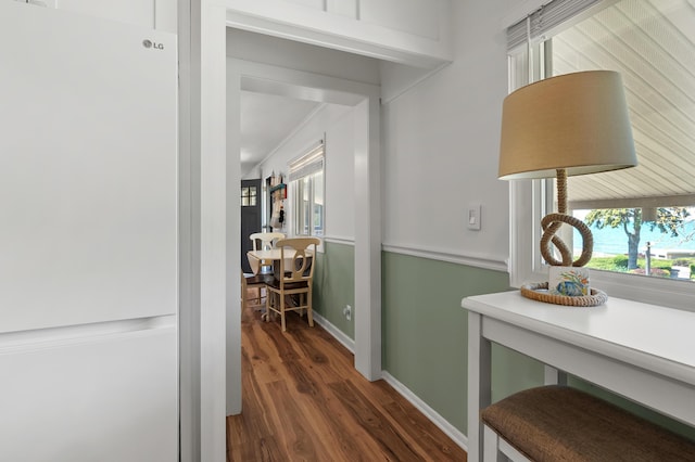 4150 Ridge Rd Unit 21And 22, Stevensville, MI 49127 - corridor with healthy amount of natural light, wood finished floors, and baseboards