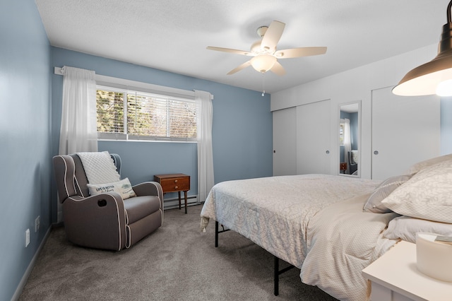 4150 Ridge Rd Unit 21And 22, Stevensville, MI 49127 - carpeted bedroom featuring a baseboard radiator and a ceiling fan