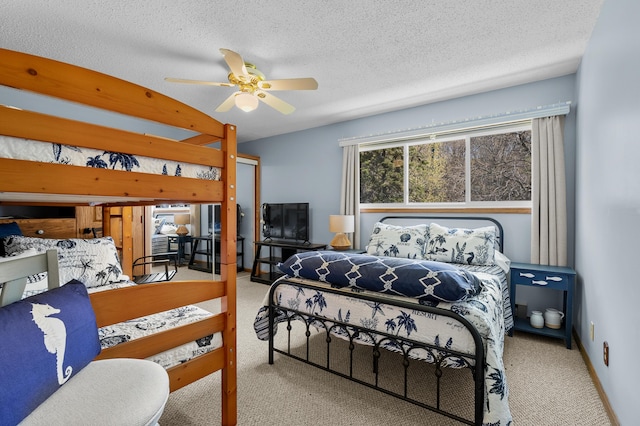 4150 Ridge Rd Unit 21And 22, Stevensville, MI 49127 - carpeted bedroom featuring a textured ceiling and ceiling fan