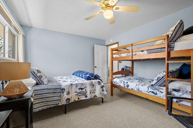4150 Ridge Rd Unit 21And 22, Stevensville, MI 49127 - bedroom with carpet, a textured ceiling, and a ceiling fan
