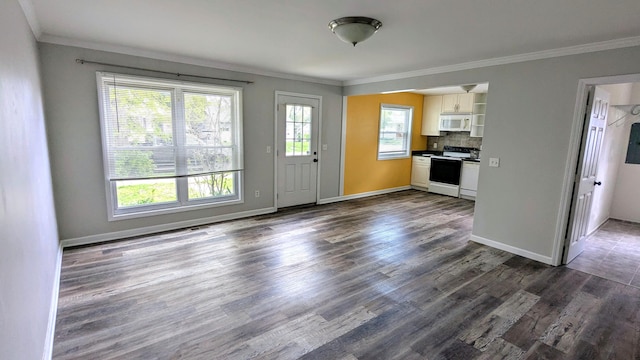 kitchen with electric stove, crown molding, white cabinetry, white microwave, and dark wood finished floors