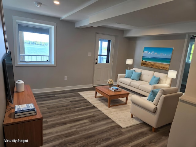 living room featuring dark wood-type flooring, baseboards, and recessed lighting