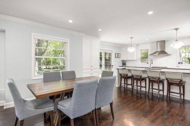 dining area with dark wood-style floors, recessed lighting, and ornamental molding