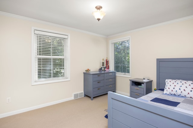 bedroom featuring crown molding, light carpet, and baseboards