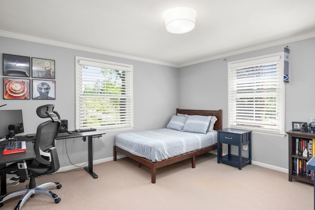 bedroom featuring ornamental molding, light colored carpet, an office area, and baseboards