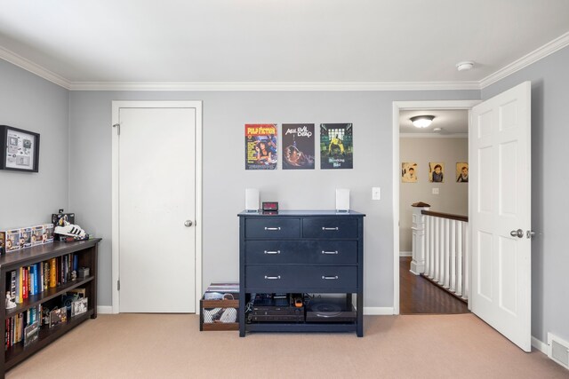 bedroom featuring ornamental molding, carpet flooring, and baseboards