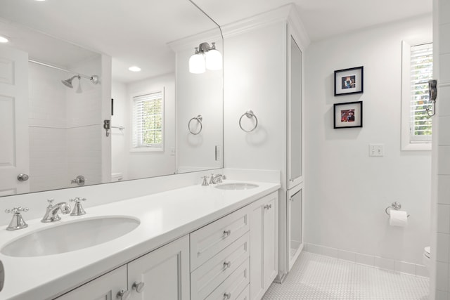 bathroom featuring toilet, double vanity, tile patterned flooring, recessed lighting, and a shower