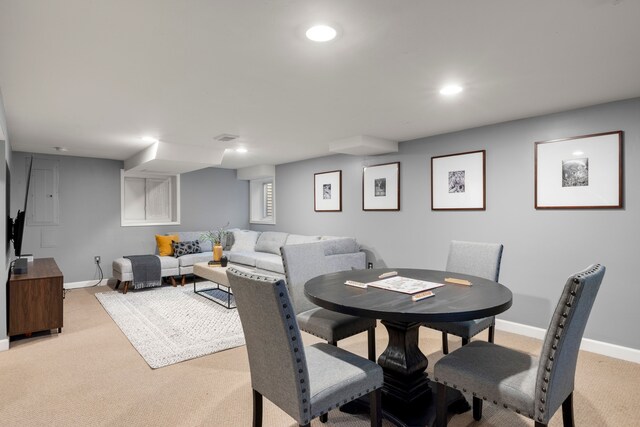 dining area featuring light colored carpet, baseboards, and recessed lighting