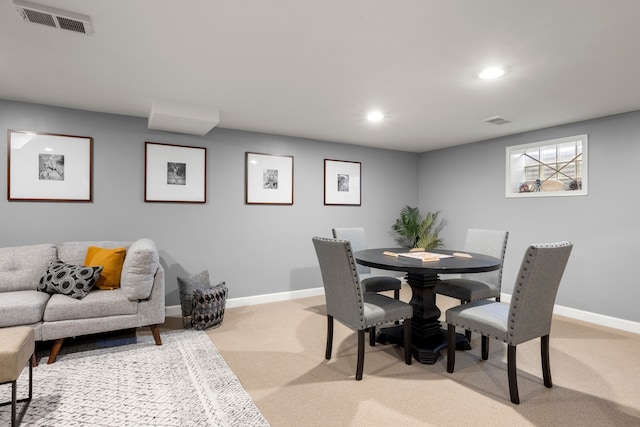 dining space with light colored carpet, recessed lighting, and baseboards
