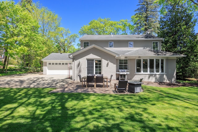 back of property with brick siding, a chimney, and a lawn