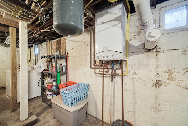 1621 W Beyer Rd, Ludington, MI 49431 - below grade area featuring water heater and washer / clothes dryer