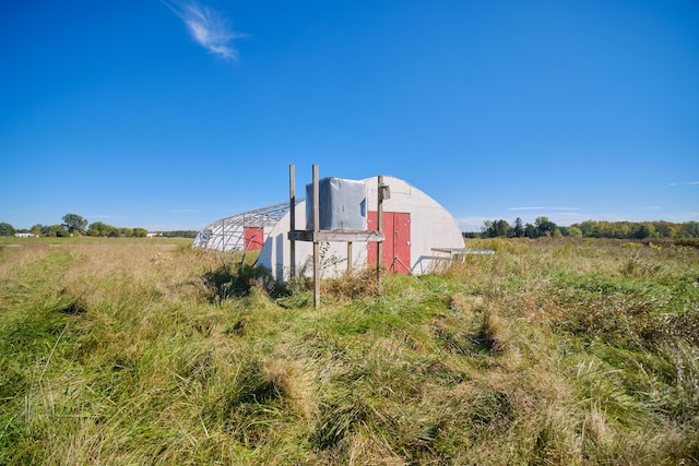 1621 W Beyer Rd, Ludington, MI 49431 - view of yard featuring an outdoor structure and a rural view