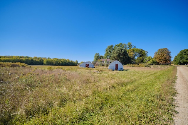 1621 W Beyer Rd, Ludington, MI 49431 - view of yard featuring a view of rural / pastoral area, an outbuilding, and a storage shed