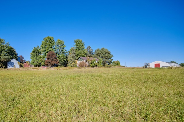 1621 W Beyer Rd, Ludington, MI 49431 - view of yard with a garage and an outbuilding