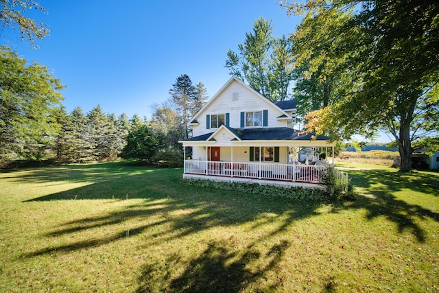 1621 W Beyer Rd, Ludington, MI 49431 - back of property with a lawn and covered porch