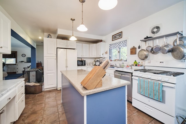 1621 W Beyer Rd, Ludington, MI 49431 - kitchen featuring white appliances, a center island, white cabinetry, hanging light fixtures, and light stone counters