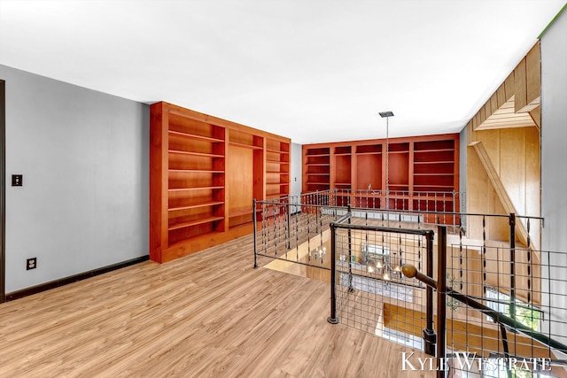 405 S 1st St, Edmore, MI 48829 - interior space featuring wood finished floors, baseboards, and built in shelves