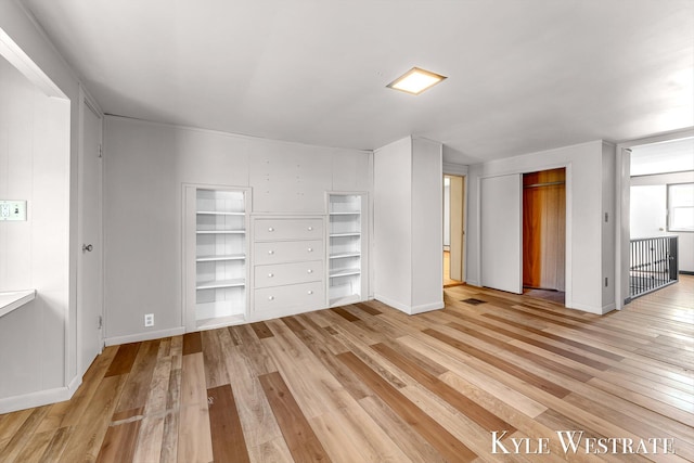 405 S 1st St, Edmore, MI 48829 - unfurnished bedroom featuring light wood finished floors and baseboards