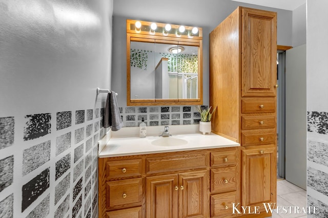 405 S 1st St, Edmore, MI 48829 - bathroom featuring vanity, tasteful backsplash, tile patterned floors, and a shower