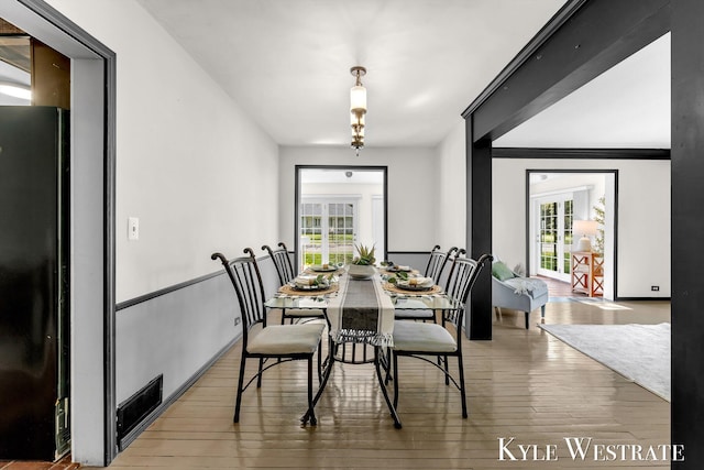 405 S 1st St, Edmore, MI 48829 - dining space featuring wood-type flooring