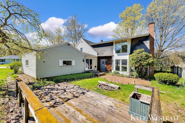 405 S 1st St, Edmore, MI 48829 - back of property with a deck and a chimney
