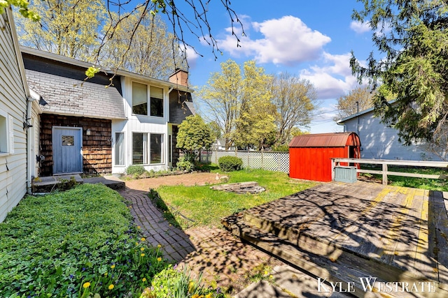 405 S 1st St, Edmore, MI 48829 - view of yard with a storage unit and an outbuilding