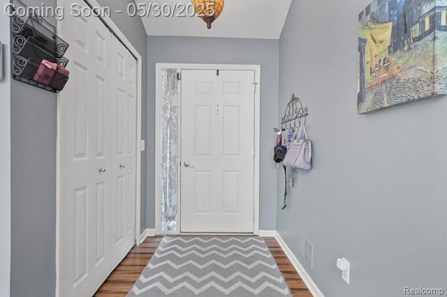 9450 Sandlewood Ct, Whitmore Lake, MI 48189 - foyer entrance featuring dark wood-style flooring and baseboards