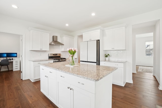 49793 Split Rock Rd, Macomb, MI 48044 - kitchen with freestanding refrigerator, stainless steel gas range oven, wall chimney exhaust hood, a center island, and decorative backsplash
