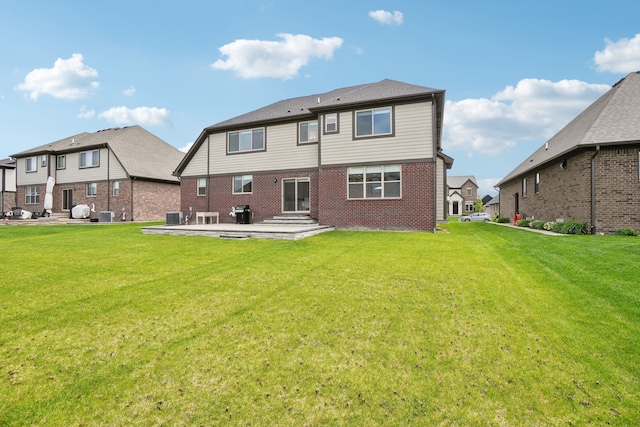 49793 Split Rock Rd, Macomb, MI 48044 - rear view of house with a patio, brick siding, a lawn, and central air condition unit