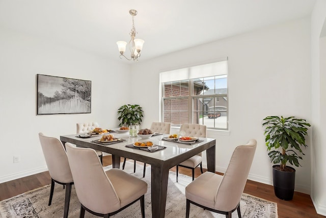 49793 Split Rock Rd, Macomb, MI 48044 - dining area featuring wood finished floors, baseboards, and a chandelier