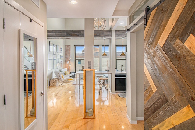 101 W Liberty St Unit 320, Ann Arbor, MI 48104 - hall with hardwood / wood-style floors, a chandelier, and recessed lighting