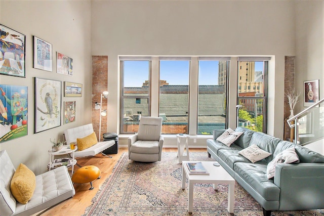 101 W Liberty St Unit 320, Ann Arbor, MI 48104 - living room featuring wood finished floors and a high ceiling