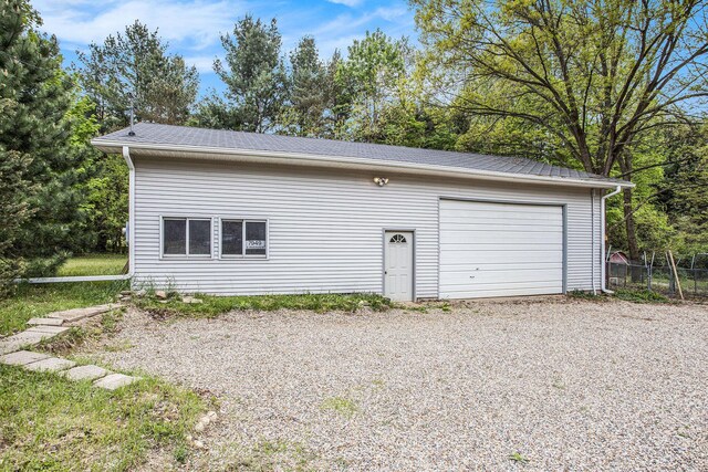 detached garage with fence