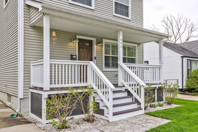 view of exterior entry featuring a porch
