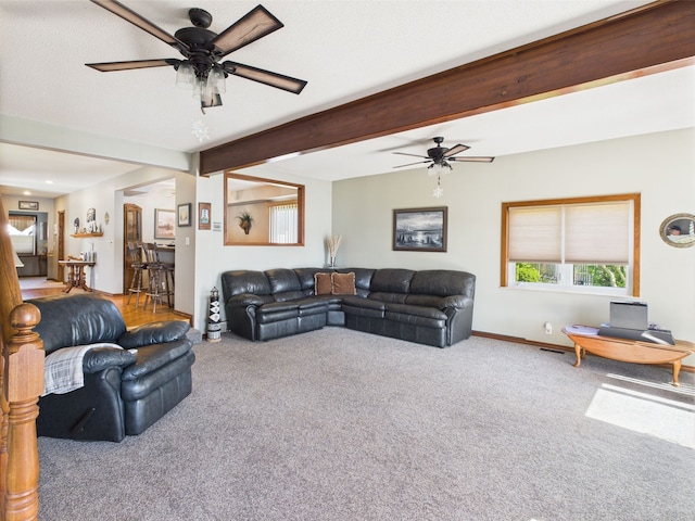 480 Peninsula Dr, Columbiaville, MI 48421 - living area with carpet floors, ceiling fan, beam ceiling, and baseboards