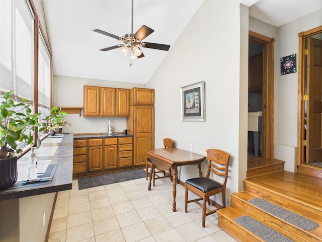 480 Peninsula Dr, Columbiaville, MI 48421 - dining space featuring ceiling fan and high vaulted ceiling